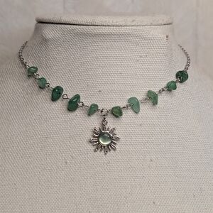 Chic Silver Necklace with Green Gemstones and Sun Pendant